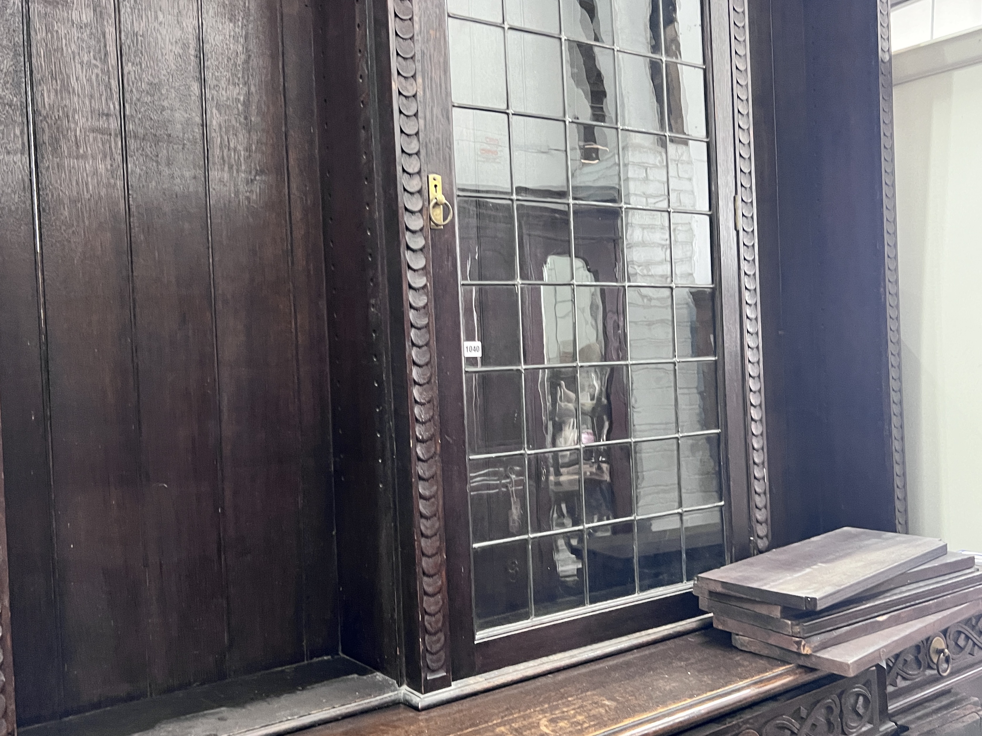 An early 20th century carved oak breakfront library bookcase, width 206cm, depth 54cm, height 260cm